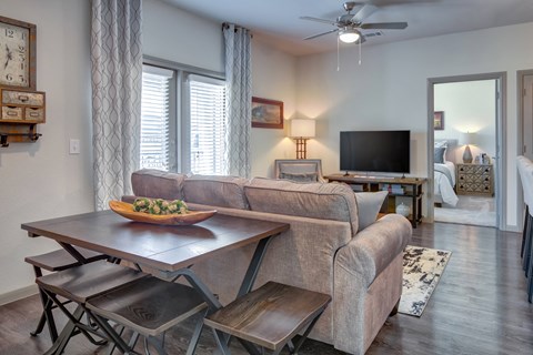 a living room and dining room with a couch and a table